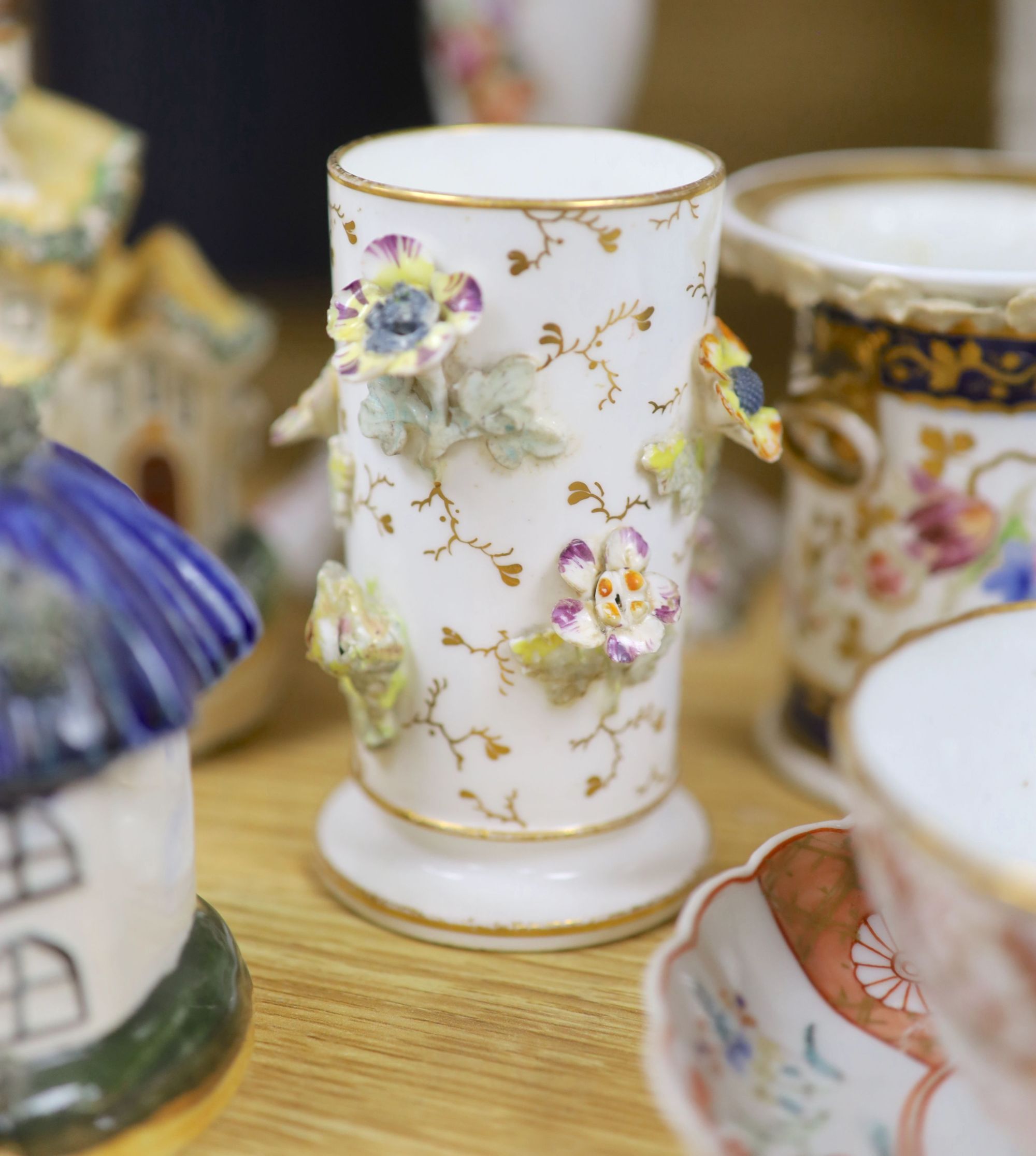 A group of mixed ceramics including a Copeland flower-painted vase, a Staffordshire hen and chick tureen and cover, Staffordshire cot